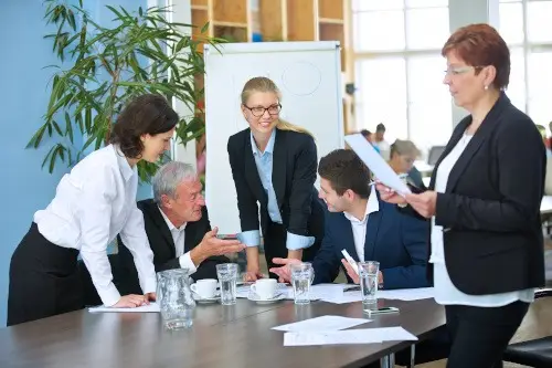 Business colleagues discussing their priorities with a consultant